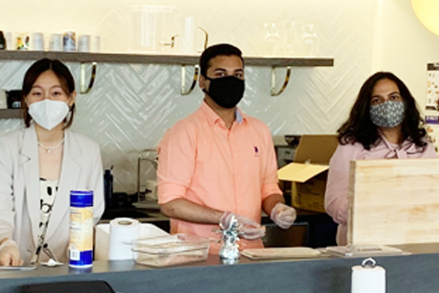 Three colleagues in the Quorum kitchen