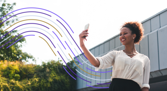 Woman holding smartphone with blue and gold digital wave graphics, outdoors near modern building, representing digital com...